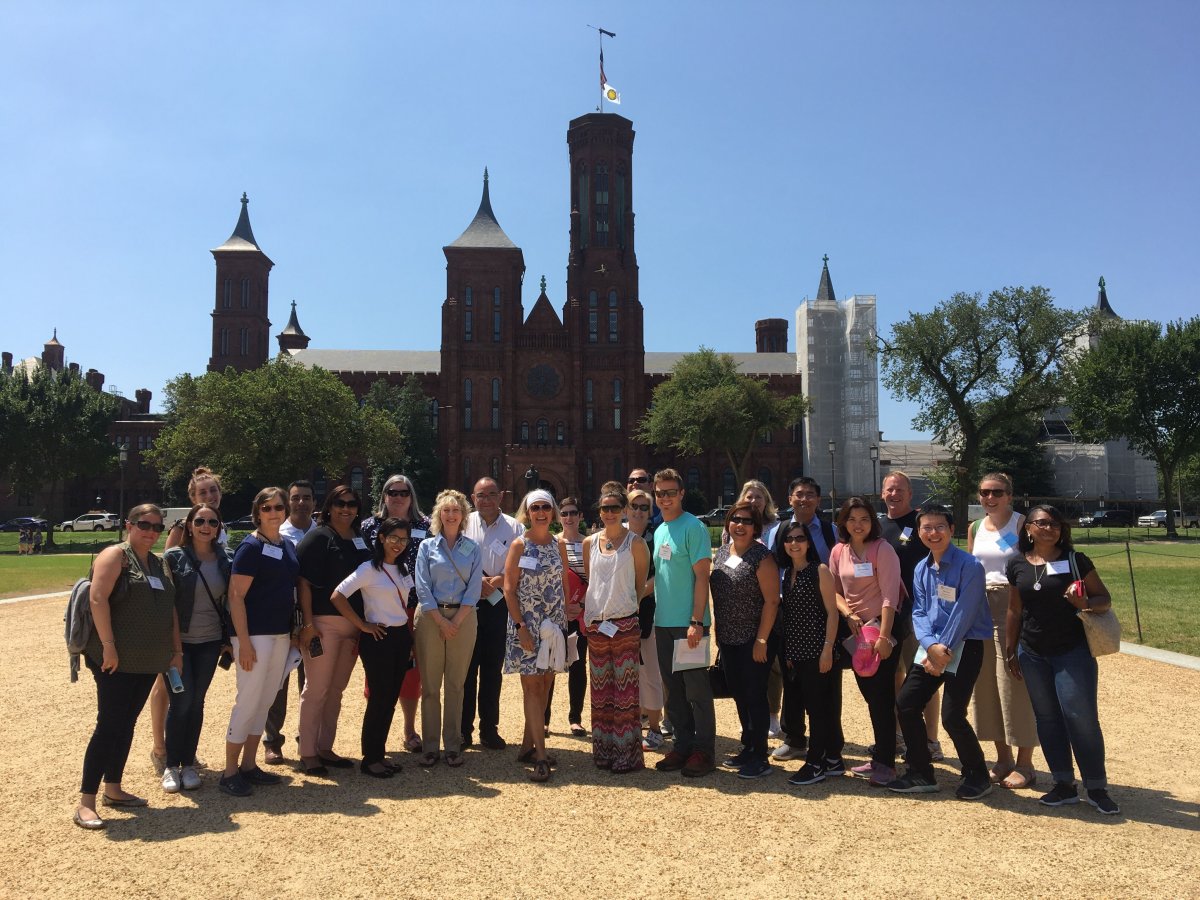 The Smithsonian National Museum of Natural History group poses outside the Smithsonian Castle.