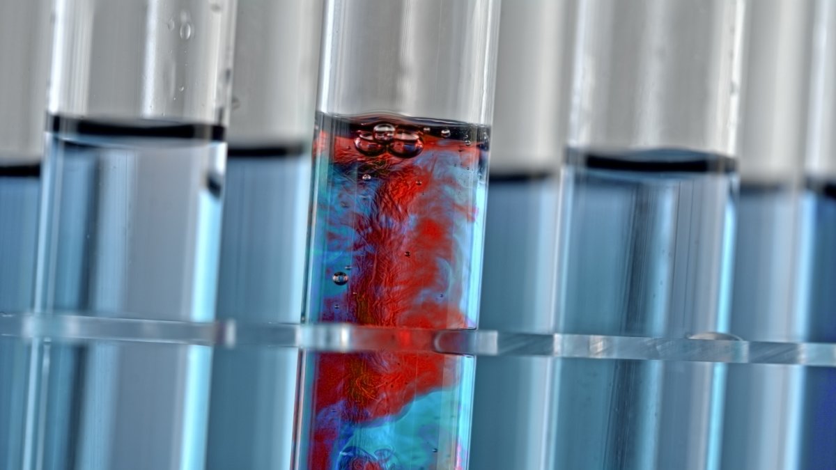 A chemical reaction taking place in a test tube in a laboratory