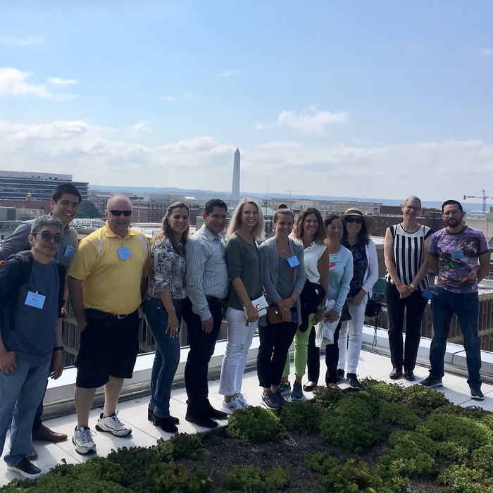 SPI Group on green rooftop of GWU's Science and Engineering Hall; Washington Monument in background