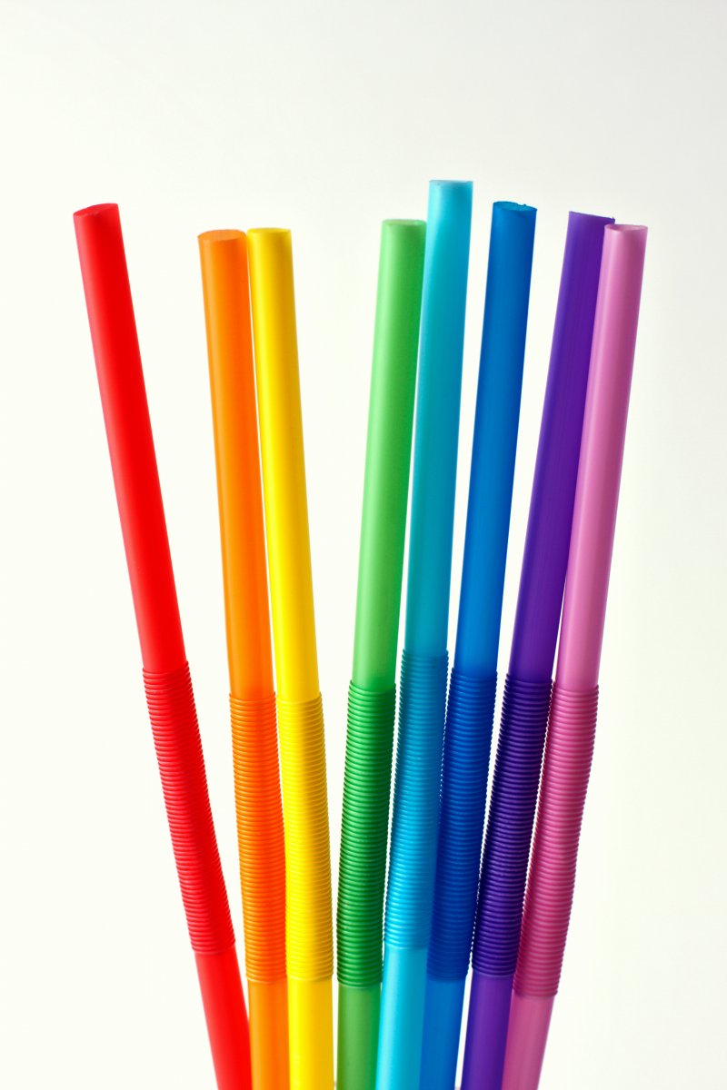 Eight plastic drinking straws.