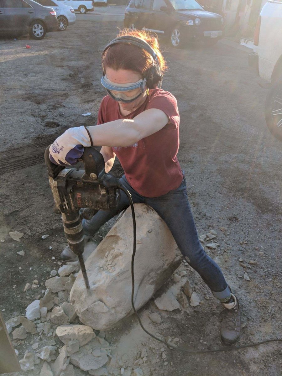 Melissa breaking the boulder