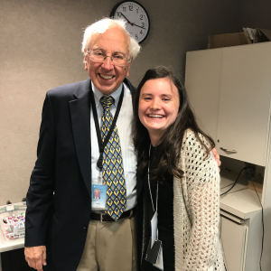 Clair posing with Dr. John Anderson