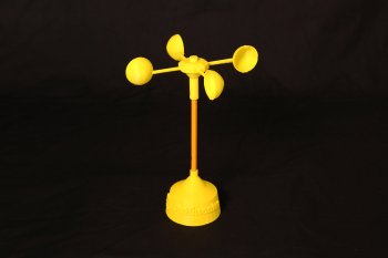 Image of a yellow 3D printed anemometer with a base, a pencil as a vertical component and four half spheres on a horizonal top piece