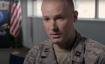 Man in military uniform looking at camera
