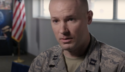 Man in military uniform looking at camera