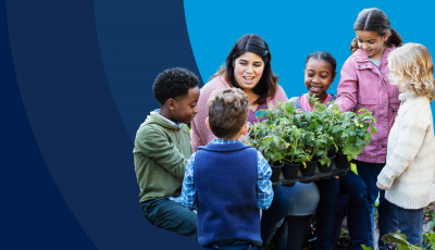 A blue background with a five students surrounding an educator with long dark brown hair examining a group of plants.