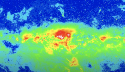 A view of the night sky in gamma rays so it shows bright green with a small bit of red yellow and blue.