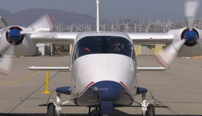 The nose of a two propeller plane.