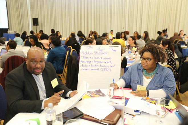 A team discusses their problem statement at the leadership summit. Photo Credit: OB Grant, Fulltone Photography
