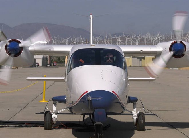 The nose of a two propeller plane.