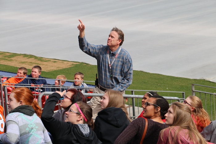 Image of students receiving a tour of the Denver Broncos Stadium 