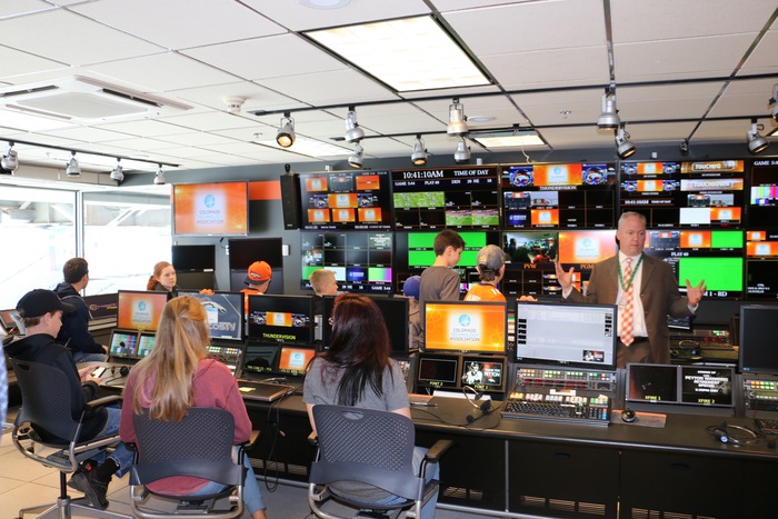 Image of students in the control room at the Denver Broncos Stadium